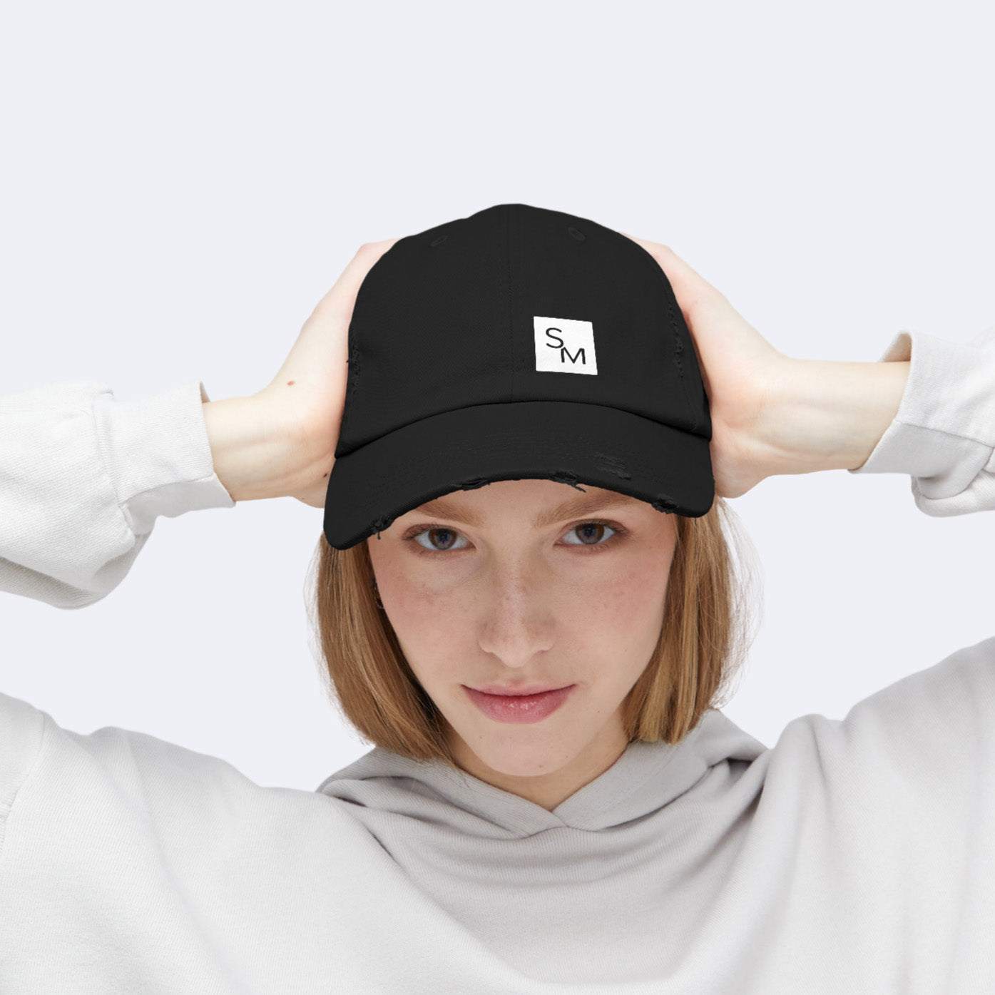 Model wearing SM Cap